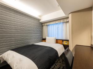 Voodi või voodid majutusasutuse APA Hotel Hatchobori Ekimae toas