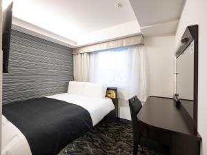 Voodi või voodid majutusasutuse APA Hotel Hatchobori Ekimae toas