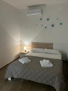 Postel nebo postele na pokoji v ubytování Stella di Mare- Cruise Shuttle