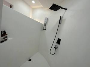 a white room with a microphone on the wall at Pawikan Seaview Villa with breakfast in Moalboal