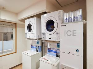 a laboratory with washing machines and other appliances at GRG Hotel Naha Higashimachi in Naha