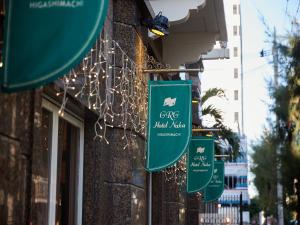 a group of signs on the side of a building at GRG Hotel Naha Higashimachi in Naha