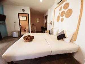 Ένα ή περισσότερα κρεβάτια σε δωμάτιο στο Minnie Seaview Resort