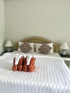 Postel nebo postele na pokoji v ubytování Tan Residence