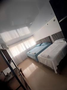 Postel nebo postele na pokoji v ubytování Casa Los Almendros , Casa Completa Valledupar