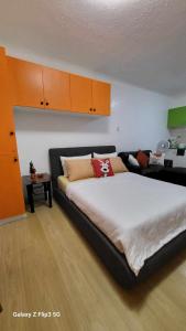 A bed or beds in a room at MNK Condo Transient - Albergo Residences