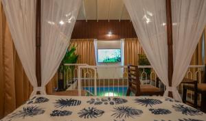 a bedroom with a bed and a window at Swimup - Suites with private pool , Vagator in Vagator