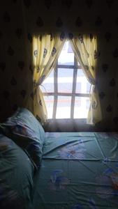 Voodi või voodid majutusasutuse Mountain Meadow Dawaipani toas