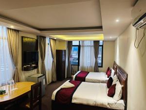 TV a/nebo společenská místnost v ubytování Hotel de Universal