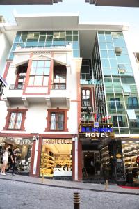 a store front of a building on a street at Alpinn Hotel Istanbul in Istanbul