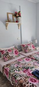 two beds sitting next to each other in a room at Apartment Marina 1 in Asprovalta