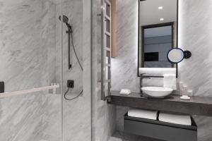 a bathroom with a sink and a shower at JW Marriott Hotel Istanbul Marmara Sea in Istanbul