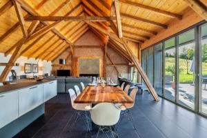 a dining room with a wooden table and chairs at Rebenhaus Loft in Baden-Baden