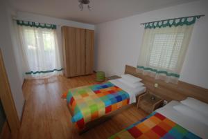 Postel nebo postele na pokoji v ubytování Springs Apartments & Rooms