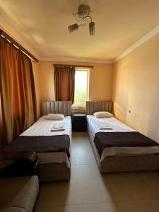 Voodi või voodid majutusasutuse Home Hotel toas