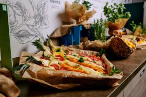 a table topped with a large sandwich on top at Hotel Istra - Liburnia in Opatija