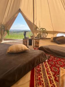 Ein Bett oder Betten in einem Zimmer der Unterkunft Domaine d'Escapa