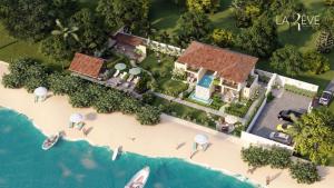 an aerial view of a house on a beach at LA RÊVE The Beach Villa in Malappuram +25 photos