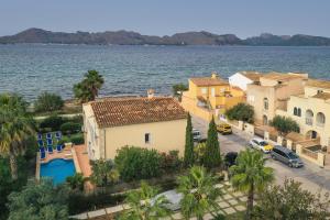 an aerial view of a town by the water at Villa AMOROS in Alcudia