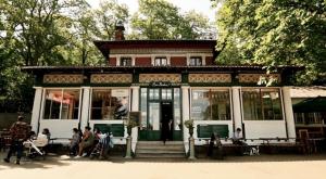 a building with people sitting outside of it at MAISON MOUZ in Paris