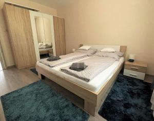 Postel nebo postele na pokoji v ubytování Ózon Apartman