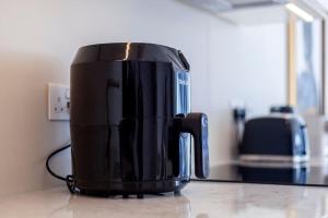 a black coffee pot sitting on top of a counter at Fantastic immense 1 BR flat, Battersea Power St in London