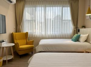 Una cama o camas en una habitación de Warmday Homestel