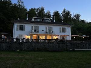 a large white house with a fence in front of it at Villa Moncoeur in Remiremont