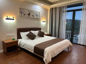 a bedroom with a bed and a view of a balcony at Outback Holiday Resort in Honiara