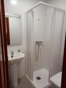 a bathroom with a shower and a sink at Casa Margarida in Allariz