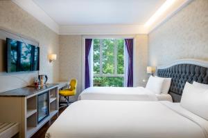 Postel nebo postele na pokoji v ubytování Mercure Tbilisi Old Town