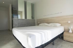 Residencial Cabo Azulにあるベッド