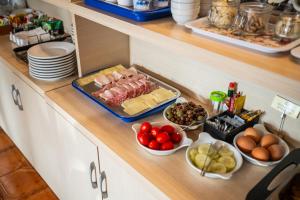 a buffet of food on a counter in a kitchen at Taormina Garden Hotel in Taormina