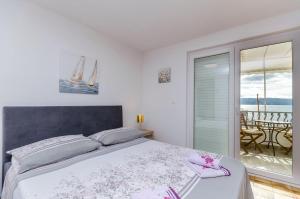 Ένα ή περισσότερα κρεβάτια σε δωμάτιο στο Apartments Bety