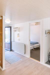 Katil atau katil-katil dalam bilik di Drømmehus Ferienwohnungen