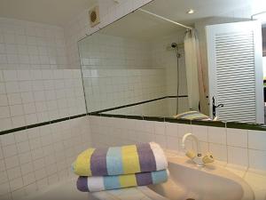 a bathroom with a sink with a towel on it at Lou Trelus in Sainte-Maxime