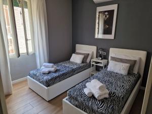 Posteľ alebo postele v izbe v ubytovaní Home K&Y - Aurelio + 14 fotografií