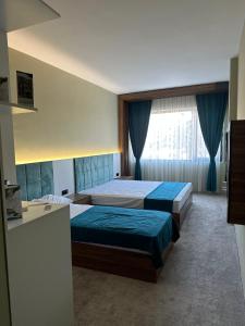 Voodi või voodid majutusasutuse Kançul Hotel Taştepeler toas