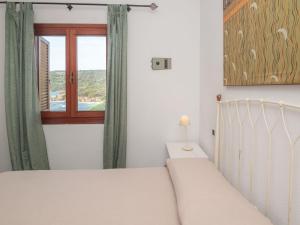 Postel nebo postele na pokoji v ubytování Apartment Ginepro by Interhome