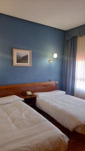Posteľ alebo postele v izbe v ubytovaní Hotel Las Moreras