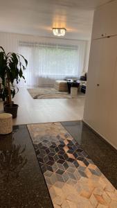 a living room with a couch and a rug at 3 Zimmerwohnung für 4 Personen in Bremen