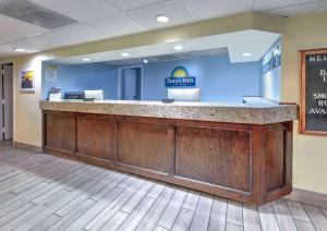 a lobby with a reception counter in a dental office at Days Inn by Wyndham Greenville MS in Greenville