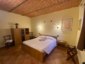 a bedroom with a large bed in a room at Agriturismo Tenuta Antica in Cessole +64 photos