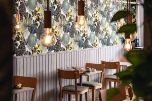 a row of tables and chairs in a restaurant at Best Western Solhem Hotel in Visby