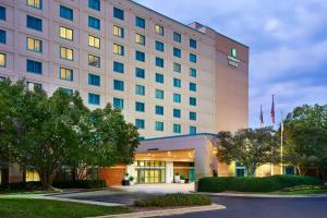 a rendering of the front of a hotel at Embassy Suites by Hilton Raleigh Durham Research Triangle in Cary