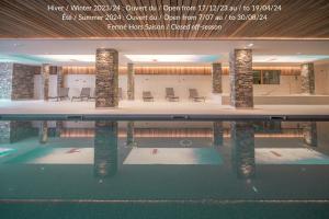 a view of a swimming pool in a building at Sky La Rosière in La Rosière