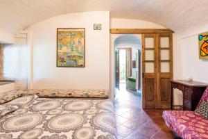 a living room with a couch and a table at B&BTorre Cives in Vidracco