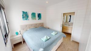 a small bedroom with a bed and a bathroom at Holidoo Travel "Villa Deluxe" in Los Alcázares +22 photos