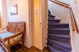 a blue staircase in a room with a stair case at Ruime woning in het centrum van Domburg in Domburg