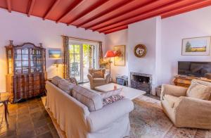 a living room with couches and a fireplace at Ruime woning in het centrum van Domburg in Domburg